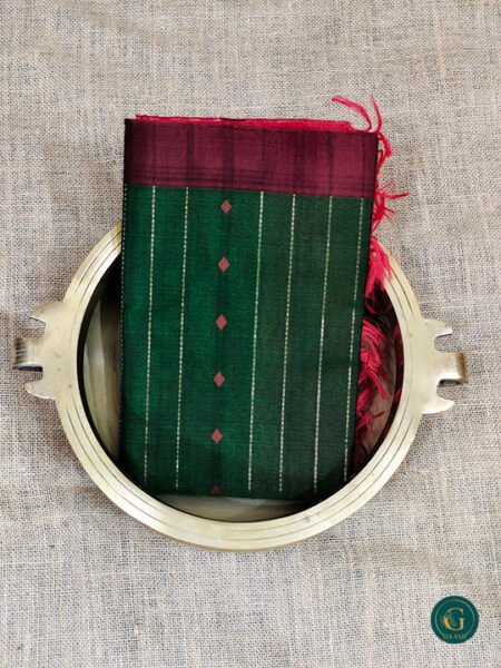 Kora Silk Cotton Saree in a rich dark green hue, featuring a traditional Vairoosi pattern that adds texture and heritage charm.